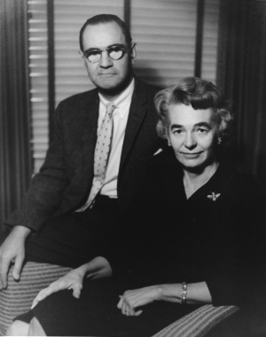 A black and white photo circa 1951 of Patrick and Aimee Mott Butler seated in an office. Patrick is slightly behind Aimee. 